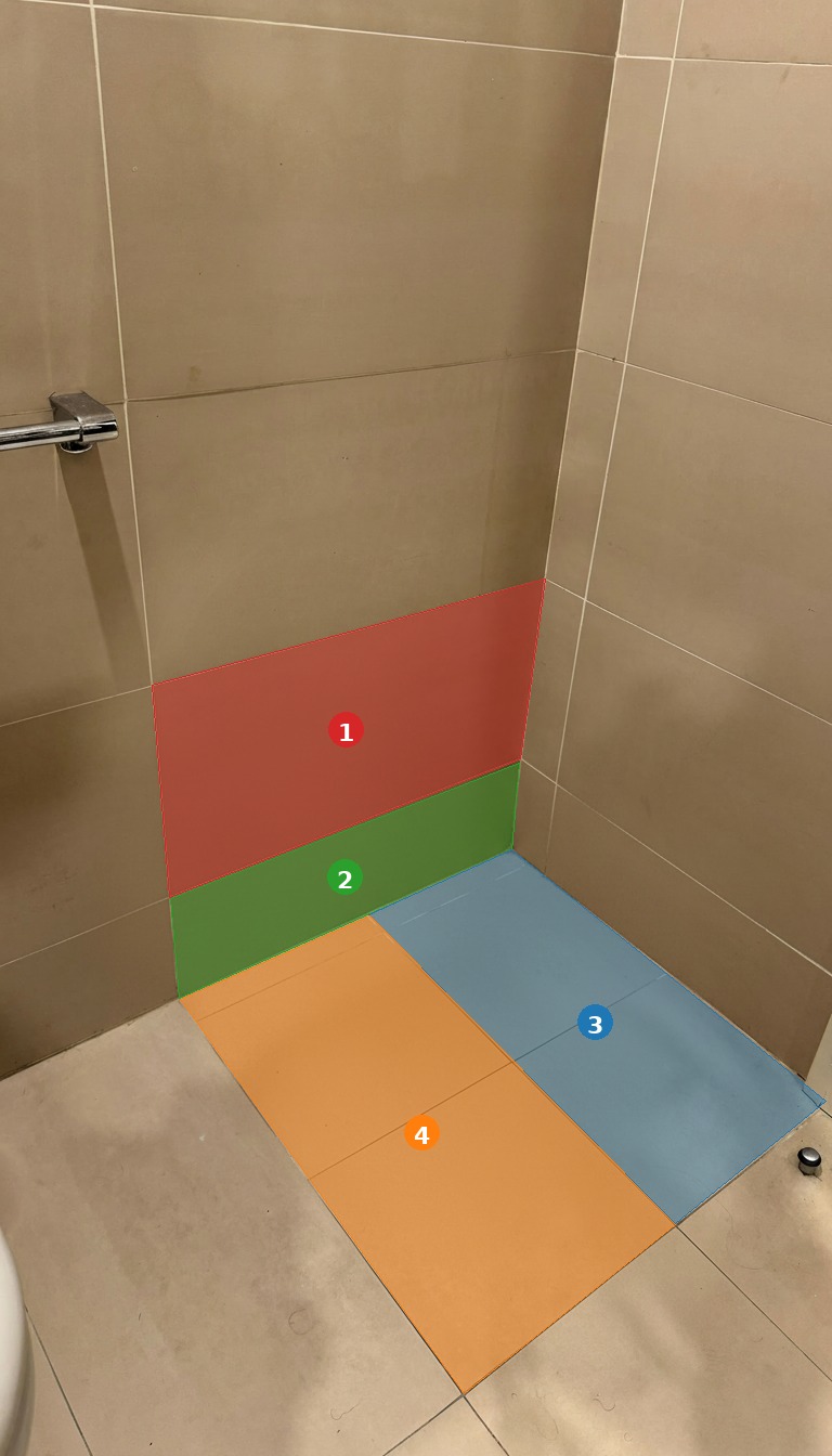 Bathroom corner with bidet removed and 4 replacement tiles highlighted in color